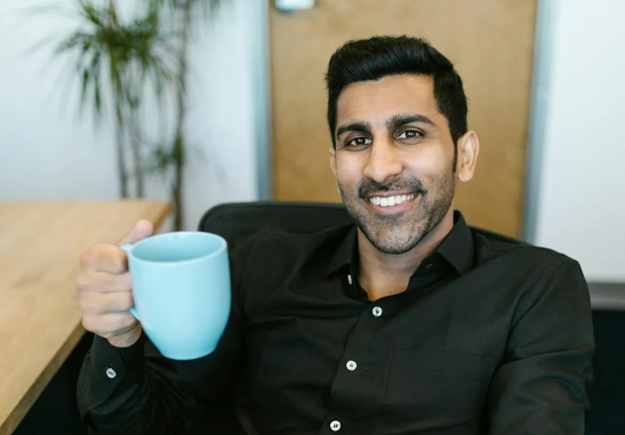 Man enjoying coffee in office